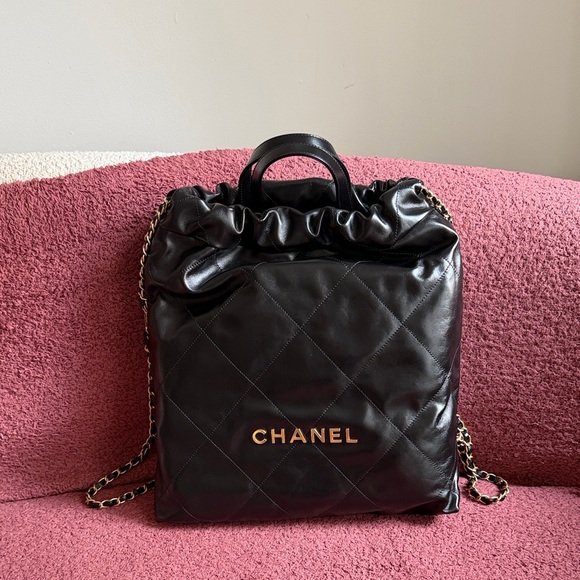 CHANEL 22 Black Quilted Backpack with Gold Accents NEW